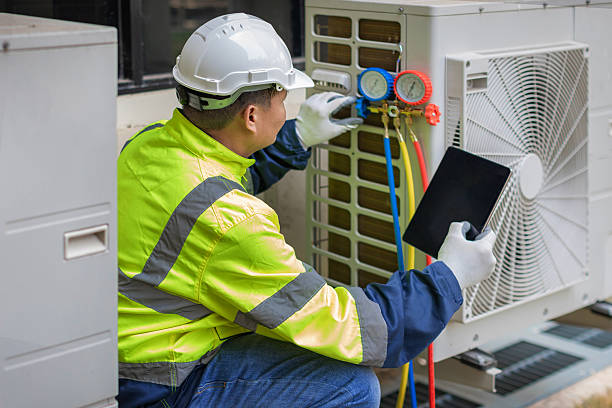 Professional Ac Installation technician working in South Amana, IA